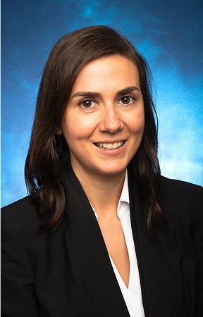 Professional headshot of a smiling woman.
