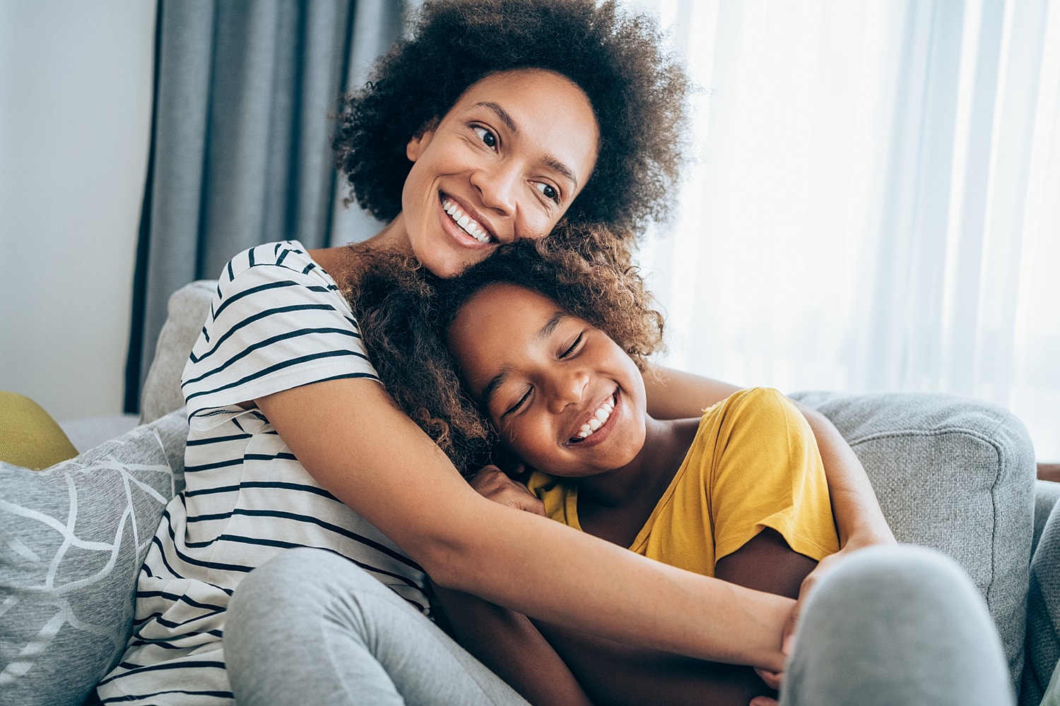 Mother and daughter enjoying a joyful moment together.