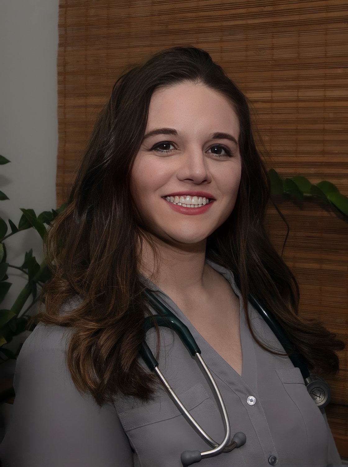 Smiling healthcare professional with a stethoscope.