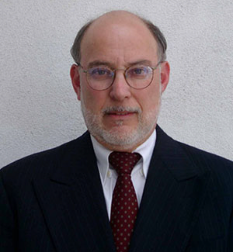 Business professional in a suit with glasses.