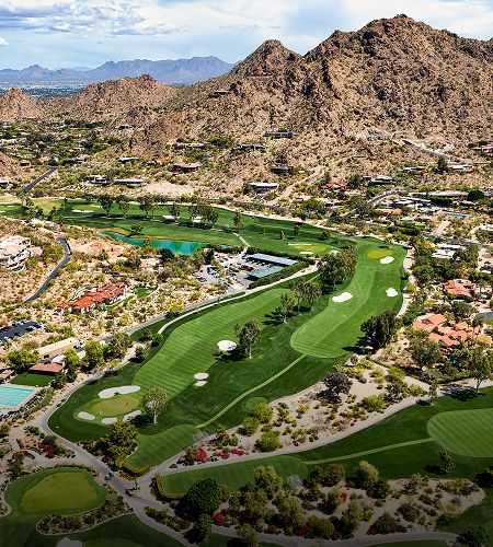 Aerial view of a scenic golf course landscape.