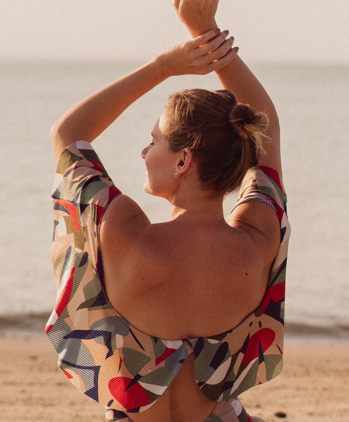 Woman enjoying beach view with colorful cover-up