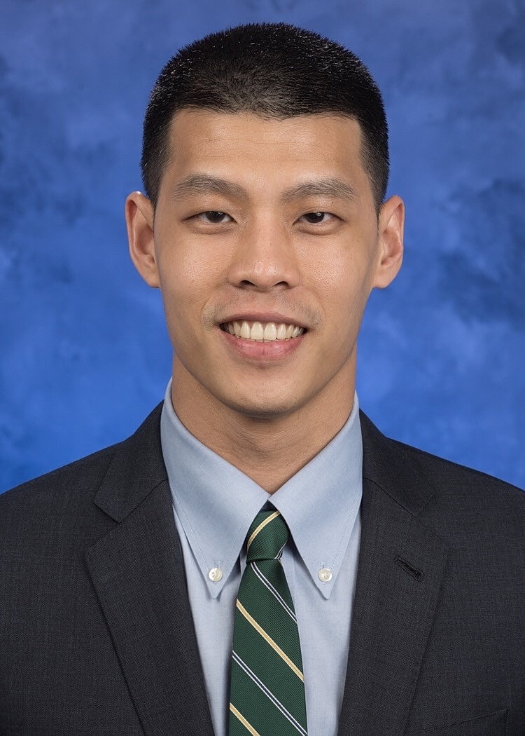 Smiling man in medical white coat portrait.