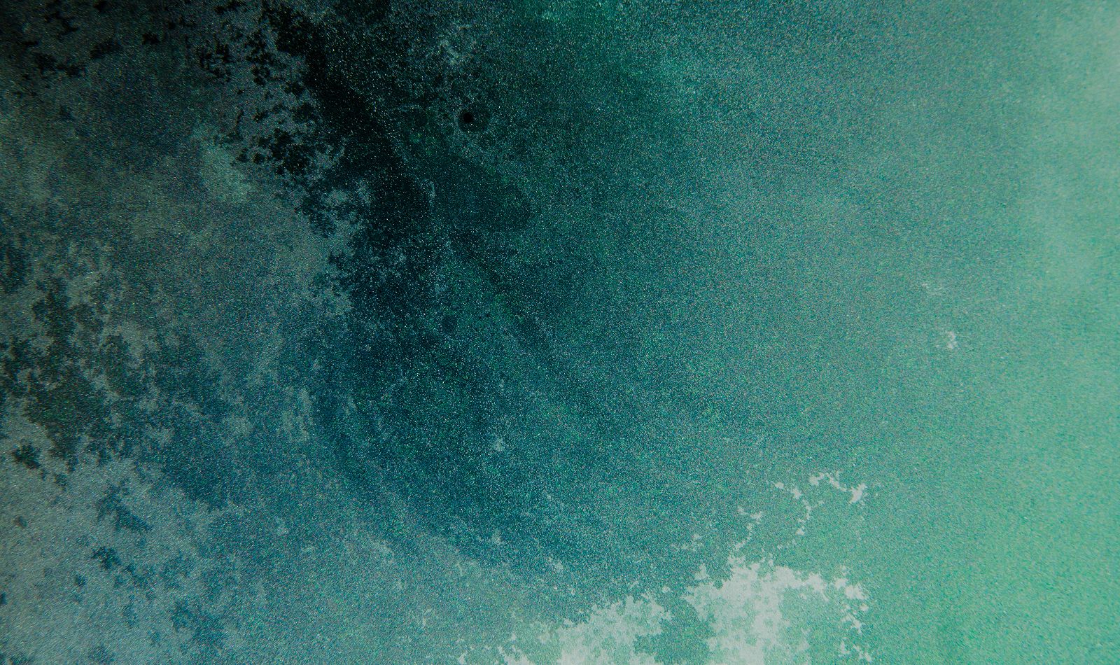 Abstract textured background in shades of blue.