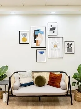 Modern living room with artwork and cozy decor.