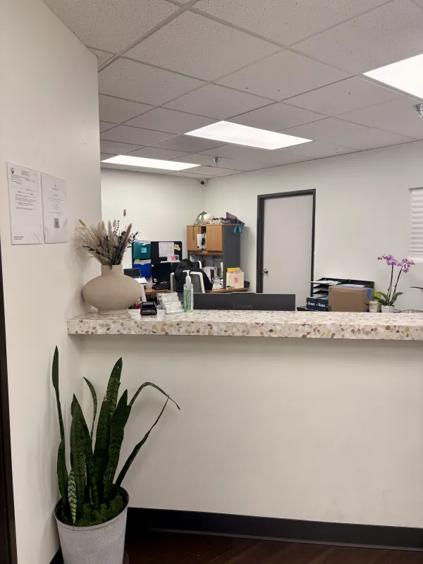Reception desk inside the Modena Health Long Beach office.