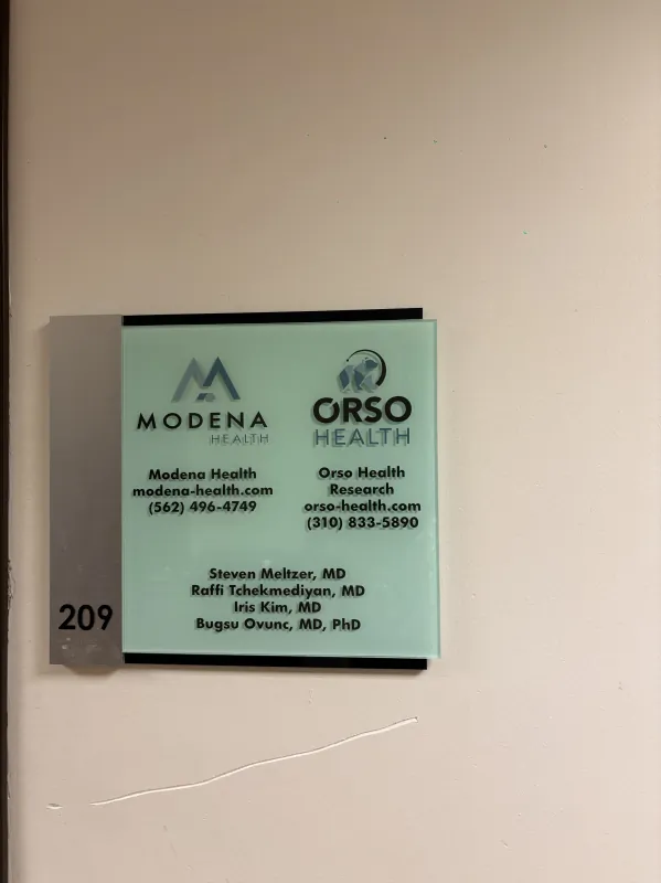 Suite 209 sign for the Modena Health Long Beach office.