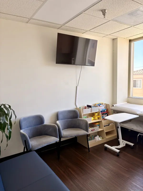 Waiting and clinical area with window seating at the Modena Health Long Beach office.
