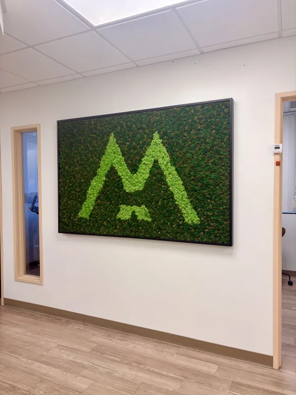 Modena Health logo wall inside the La Jolla office.