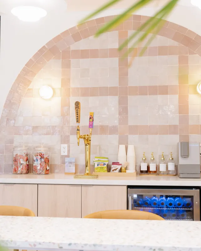 Beverage station with coffee and water inside the Solana Beach office.