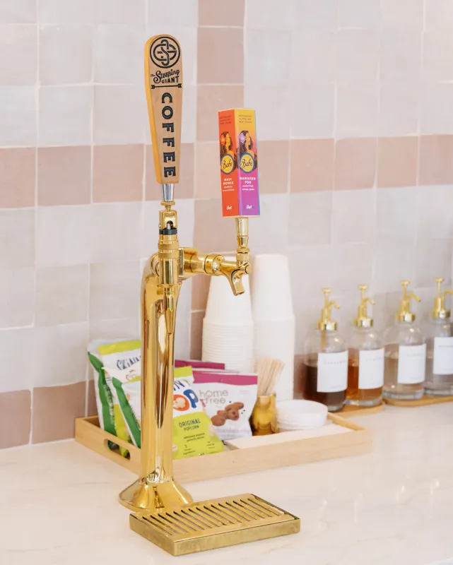Coffee tap and packaged snacks at the Solana Beach refreshment station.