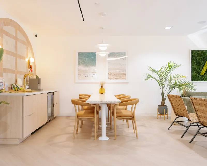 Refreshment counter and communal table inside the Modena Health Solana Beach office.