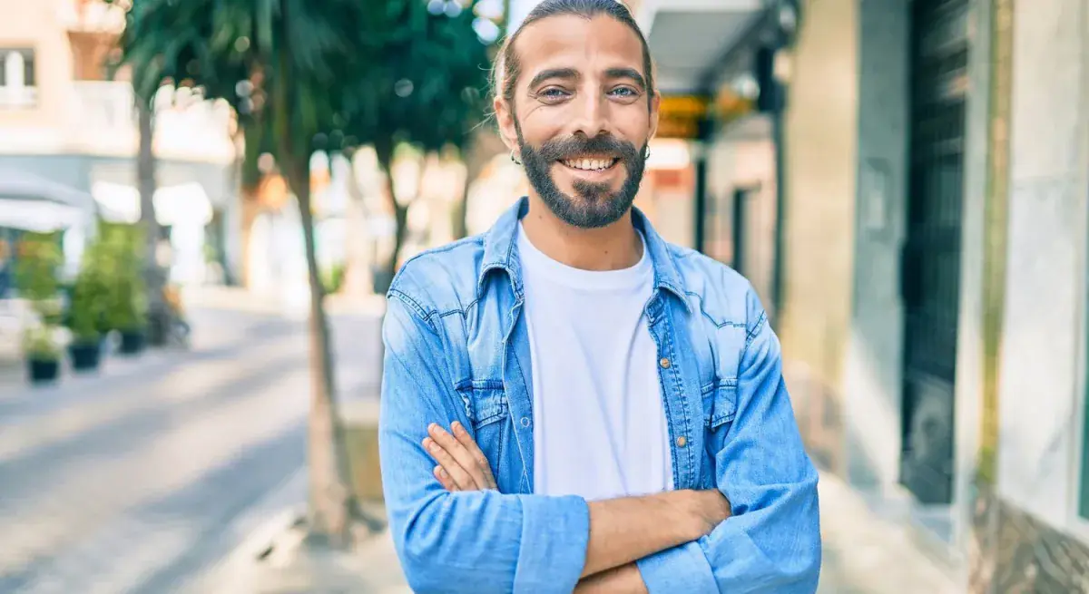 Patient smiling outdoors after receiving treatment guidance.